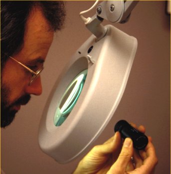 using a large stand magnifier with its own light